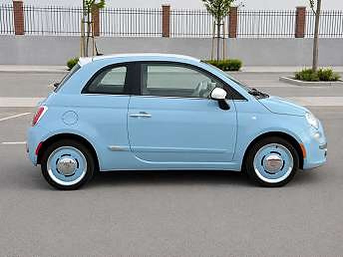 Light blue Fiat 500, four seats, available to rent
